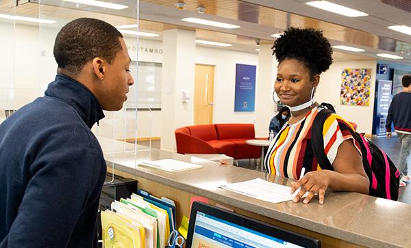 a young female African American college student is registering for classes in person at the Camden County College Blackwood Campus